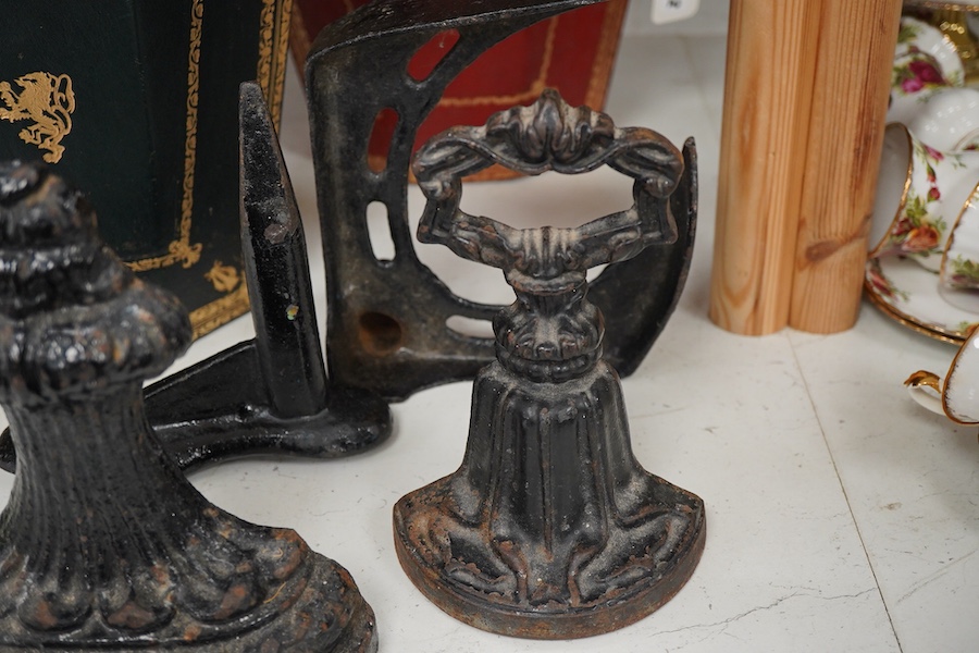 Two Italian gilt tooled leather waste paper baskets together with two Victorian cast iron doorstops and two boot scrapers, largest 29cm high